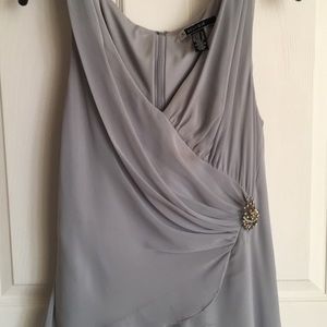 Silver silk gown with brooch